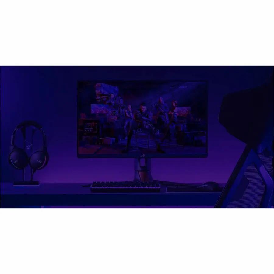 ASUS Strix Ace XG248QSG 24.1-inch FHD gaming monitor on desk with keyboard, mouse, and headset under blue lighting