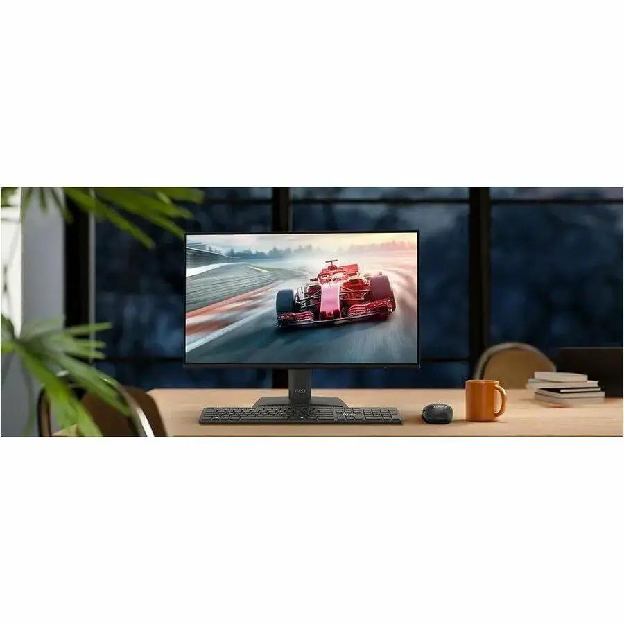 MSI Pro MP242 E14A 24-inch monitor on desk, black matte finish with keyboard and mouse.