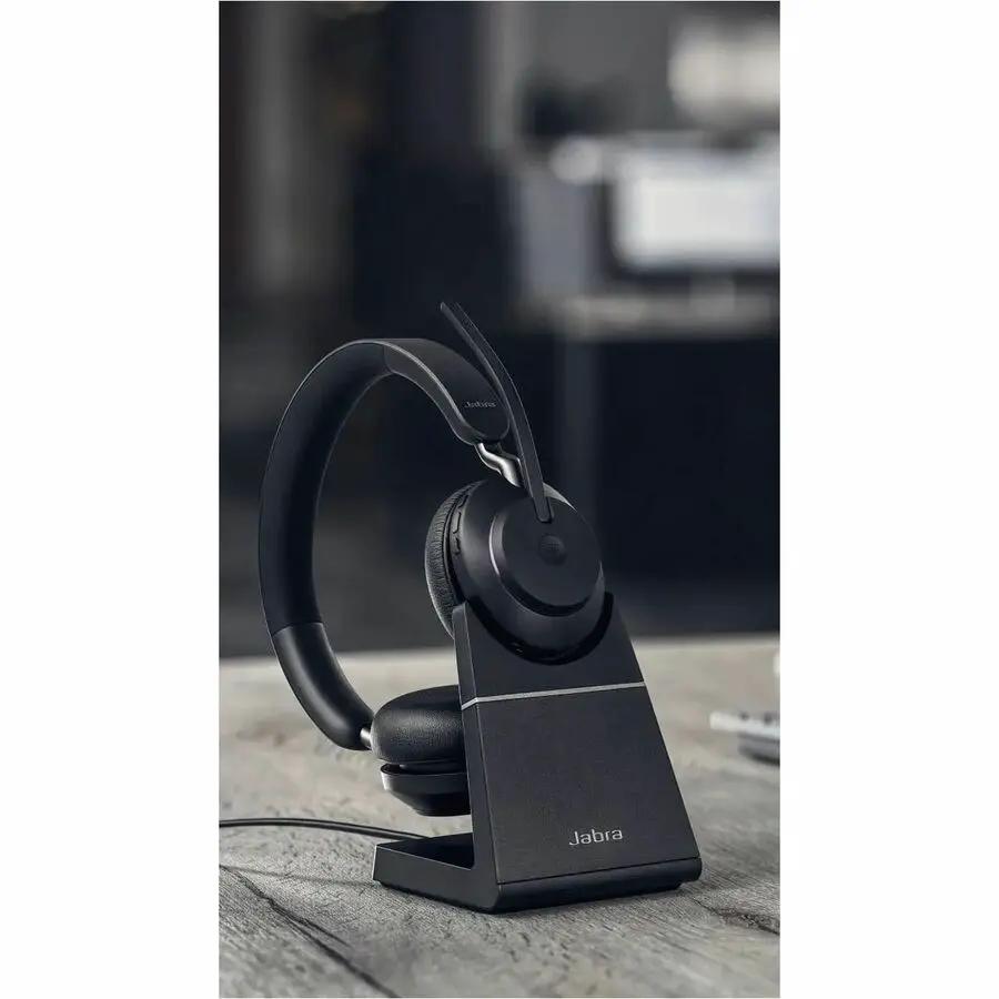 Jabra Evolve2 65 USB MS Mono headset on a black stand on a desk